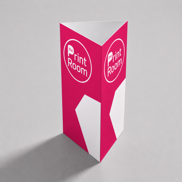 Triangular table talker featuring The Print Room round magenta logo on two visible panels, a modern pink and white geometric design, and a freestanding folded display on a neutral studio background.