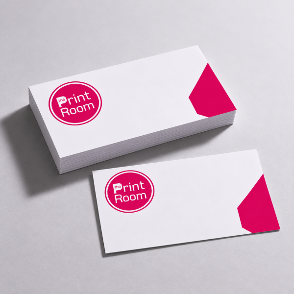 Custom correspondence cards with matching card stack, featuring the Print Room circular logo and pink corner accent, displayed on a light grey studio background.