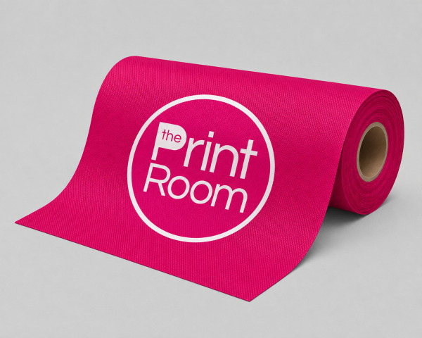 Roll of pink printed mesh banner material featuring The Print Room logo on a neutral background.