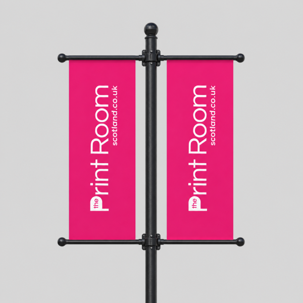Double-sided magenta lamp post banners with white Print Room branding on a black pole
