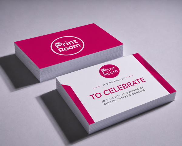 The Print Room branded celebration invitations featuring a modern pink and white design, displayed in printed card stacks.