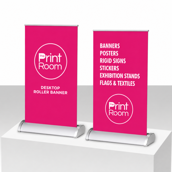 A4 and A3 pink Print Room desktop roller banners with silver bases on a white display.