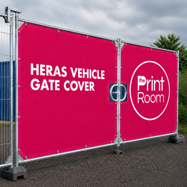 Heras vehicle gate cover fitted to a temporary metal fence with The Print Room branded pink mesh cover.