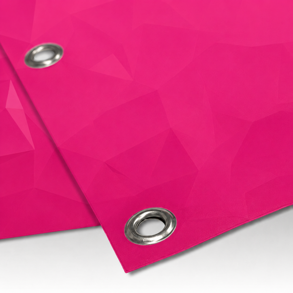 Close up of a pink Print Room banner with reinforced metal eyelets, showing the durable printed material and premium finish.