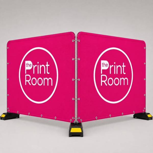 The Print Room branded double-sided Heras fence jacket with pink fabric panels and white logo, designed to fit standard Heras fencing for site branding and privacy.